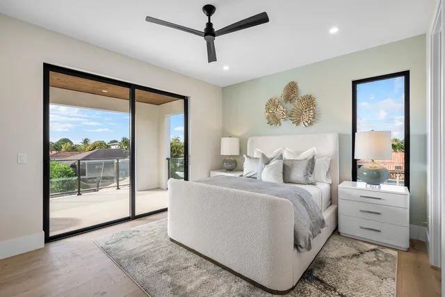 a spacious bedroom with a large bed and a window