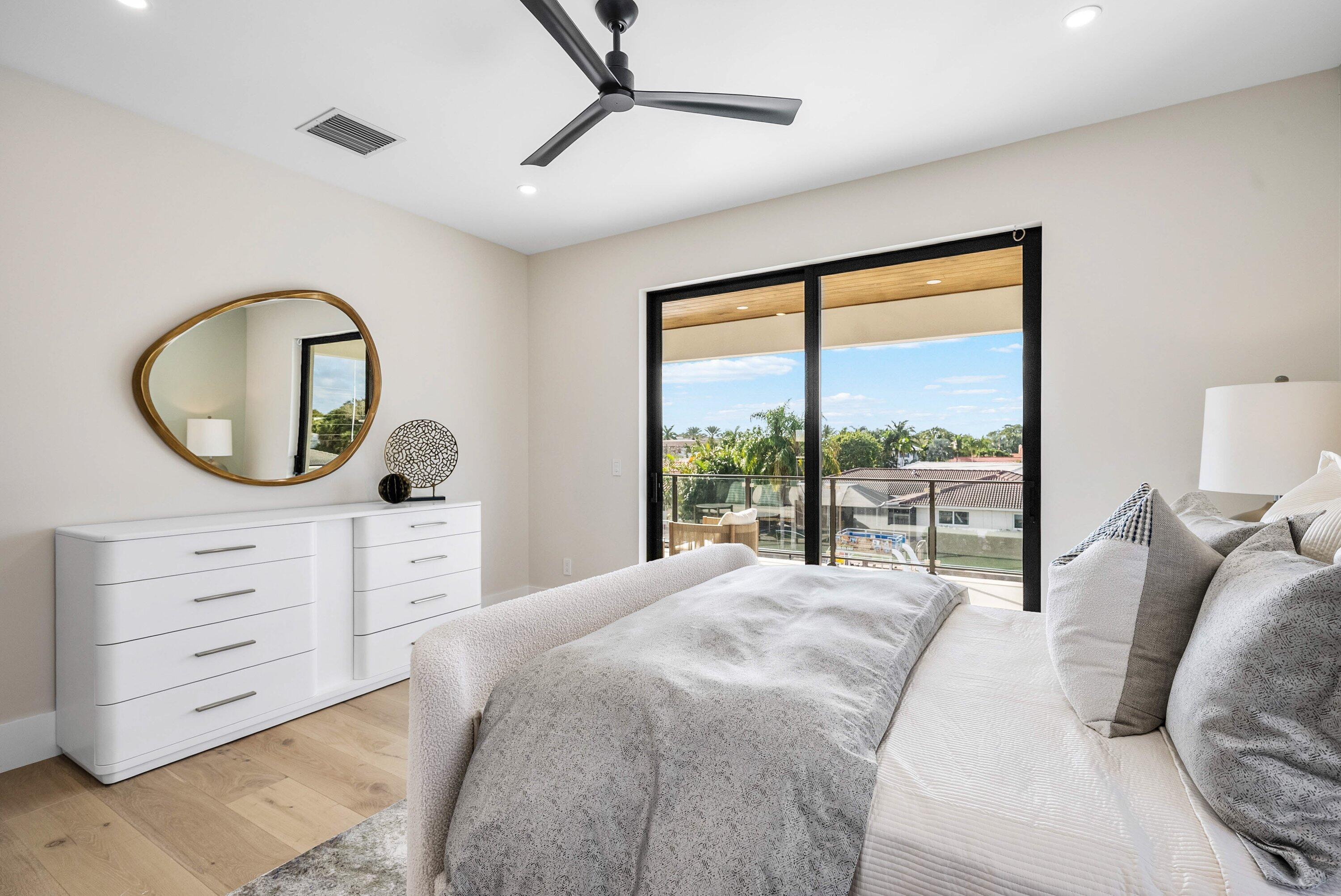 728 Enfield Street Boca Raton, FL 33487 - Photo 21 of 50 a bedroom with a bed and a dresser