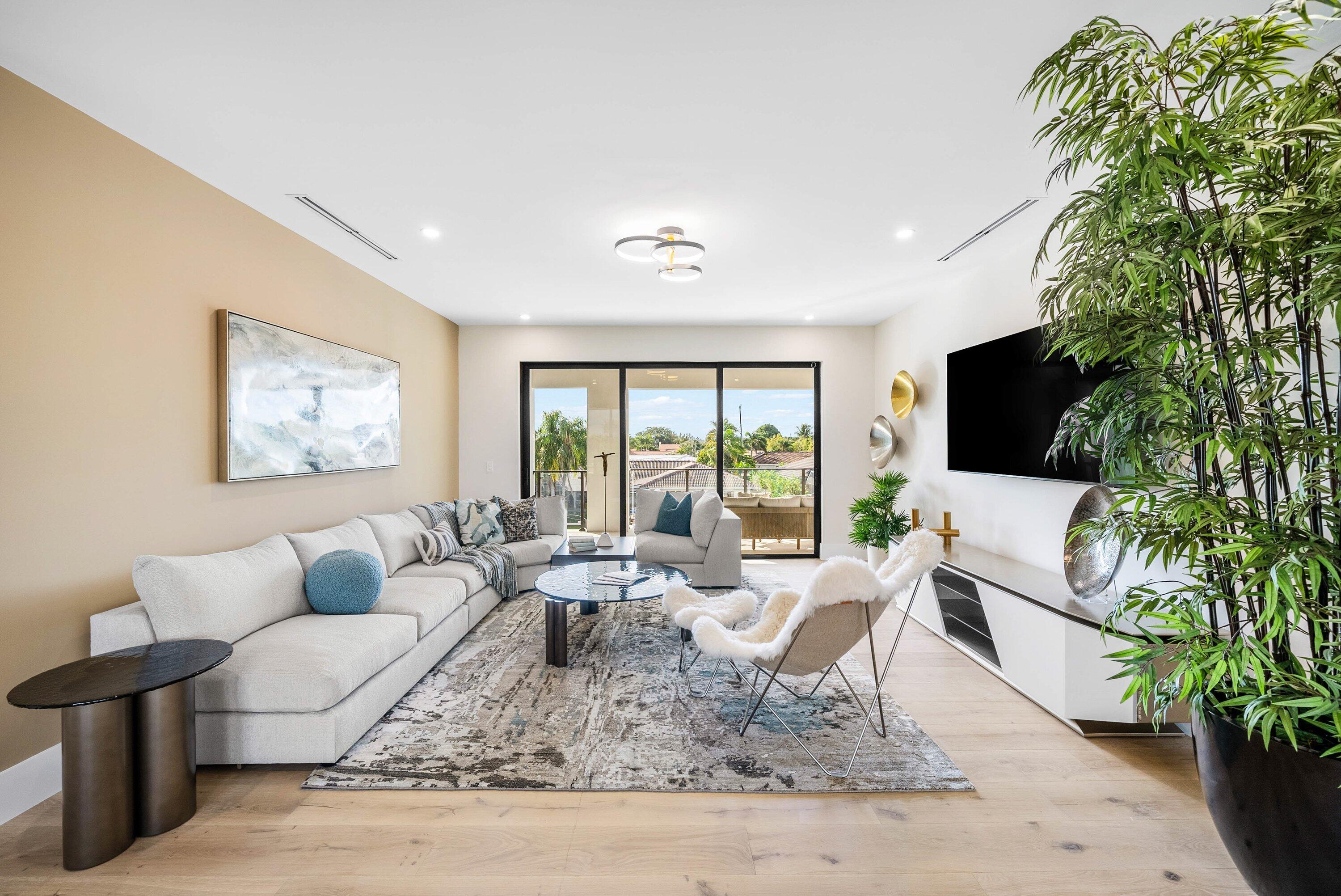 728 Enfield Street Boca Raton, FL 33487 - Photo 23 of 50 a living room with furniture large window and flat screen tv