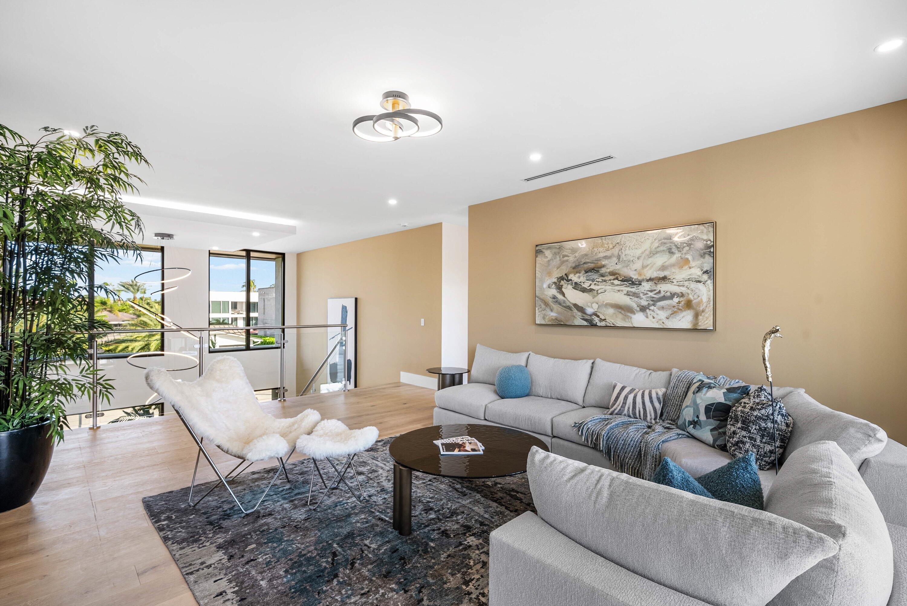 728 Enfield Street Boca Raton, FL 33487 - Photo 24 of 50 a living room with furniture and a potted plant