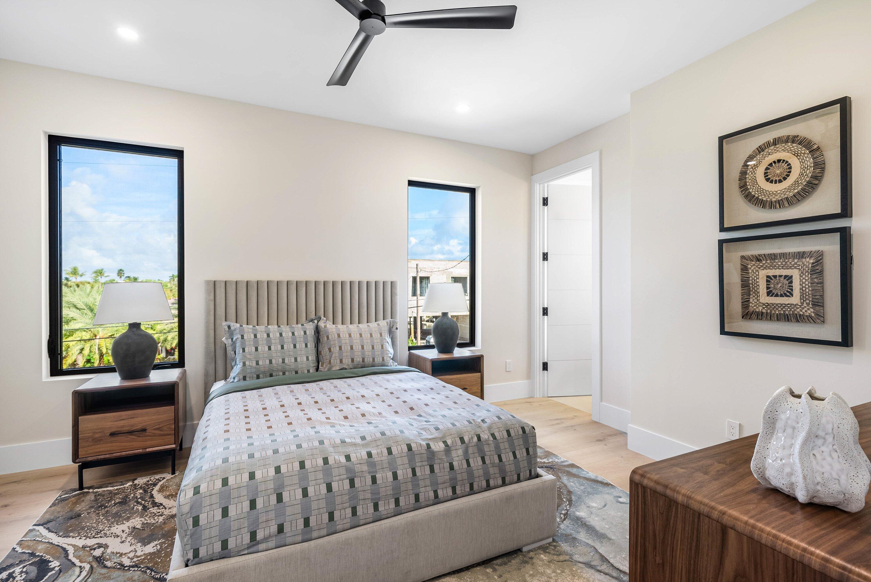 728 Enfield Street Boca Raton, FL 33487 - Photo 36 of 50 a bedroom with a large bed and a couch