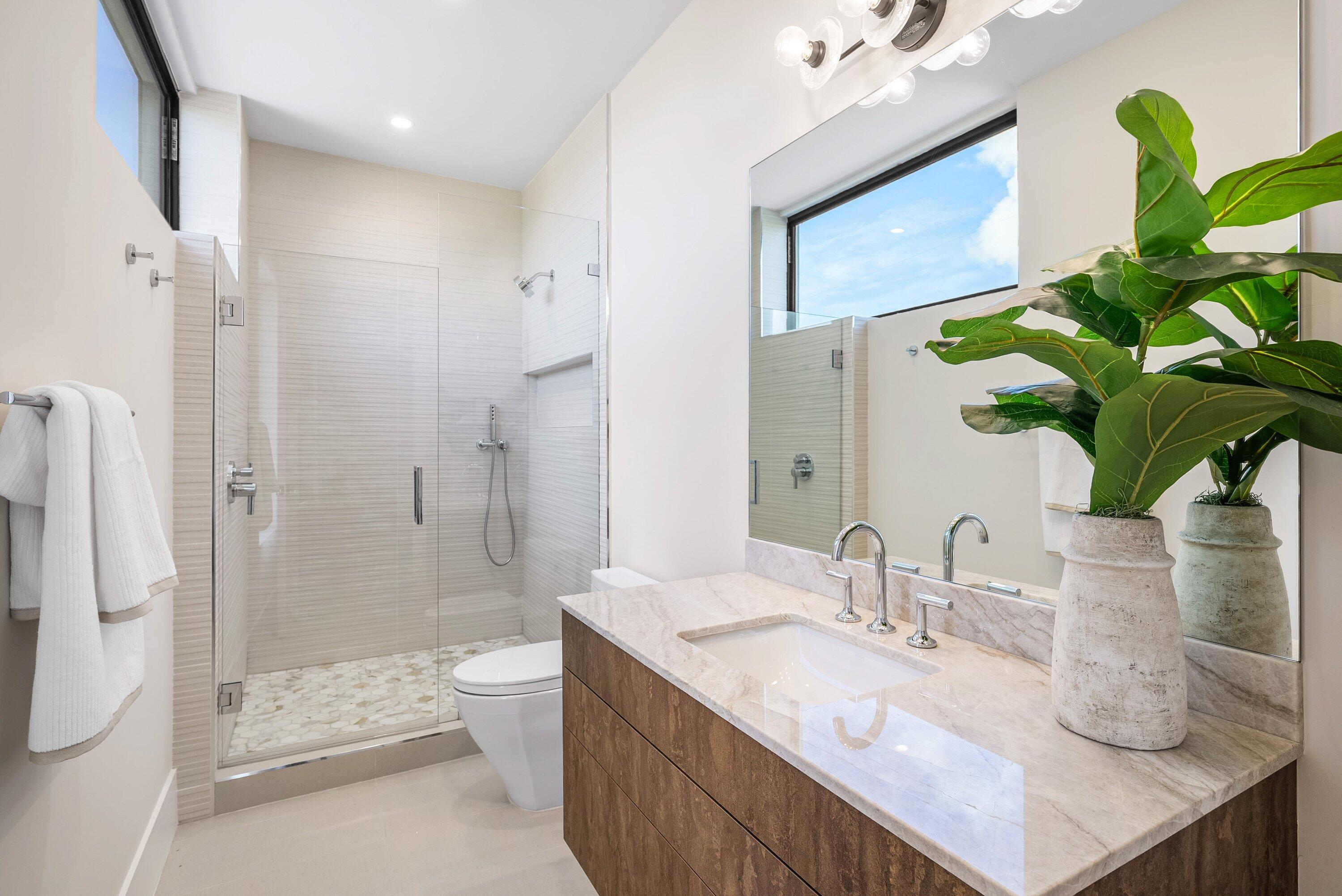728 Enfield Street Boca Raton, FL 33487 - Photo 37 of 50 a bathroom with a granite countertop sink a toilet and shower