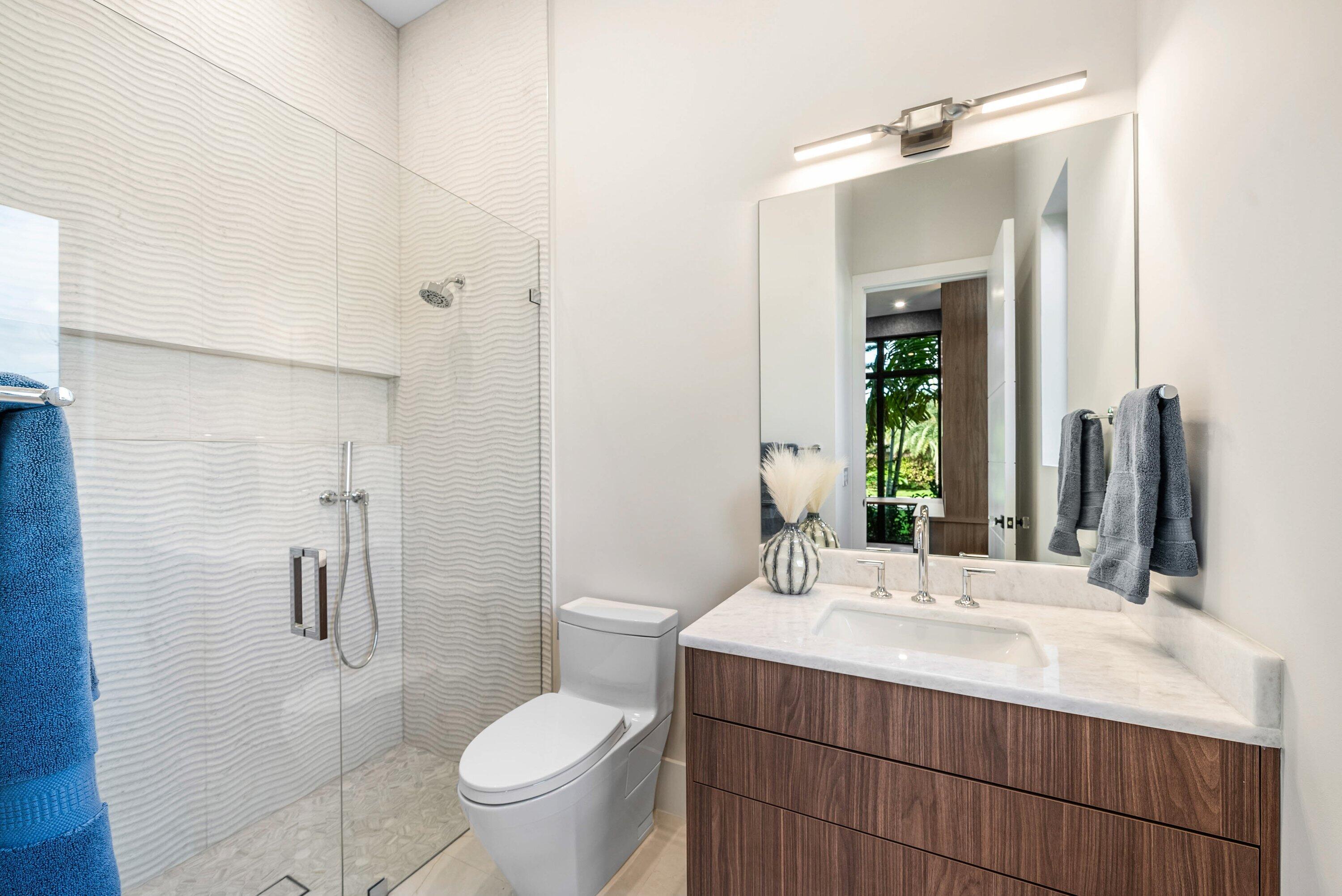 728 Enfield Street Boca Raton, FL 33487 - Photo 40 of 50 a bathroom with a sink toilet and shower