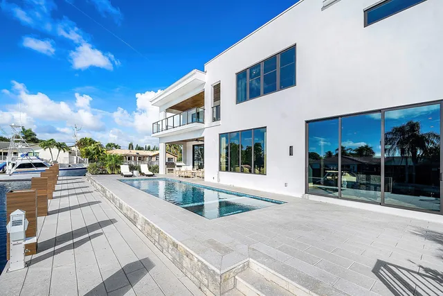 an aerial view of a house with garden space and street view