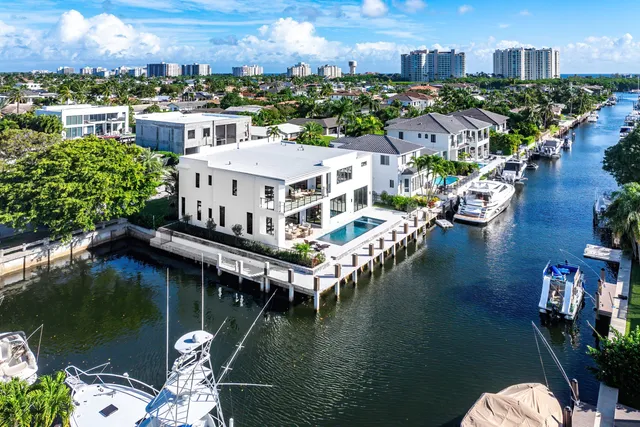 an aerial view of a house with a lake view