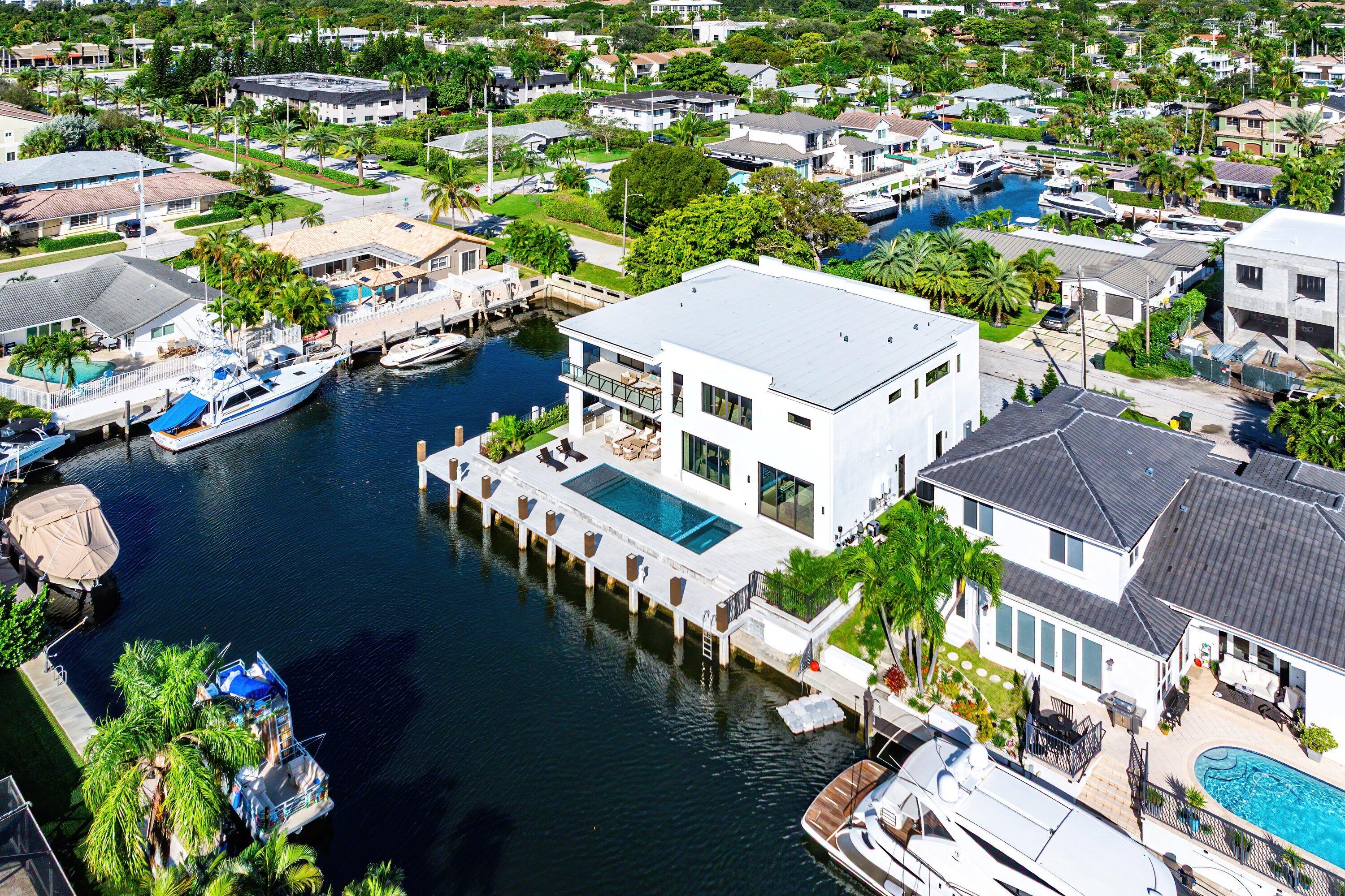 728 Enfield Street Boca Raton, FL 33487 - Photo 47 of 50 an aerial view of a house with a lake view