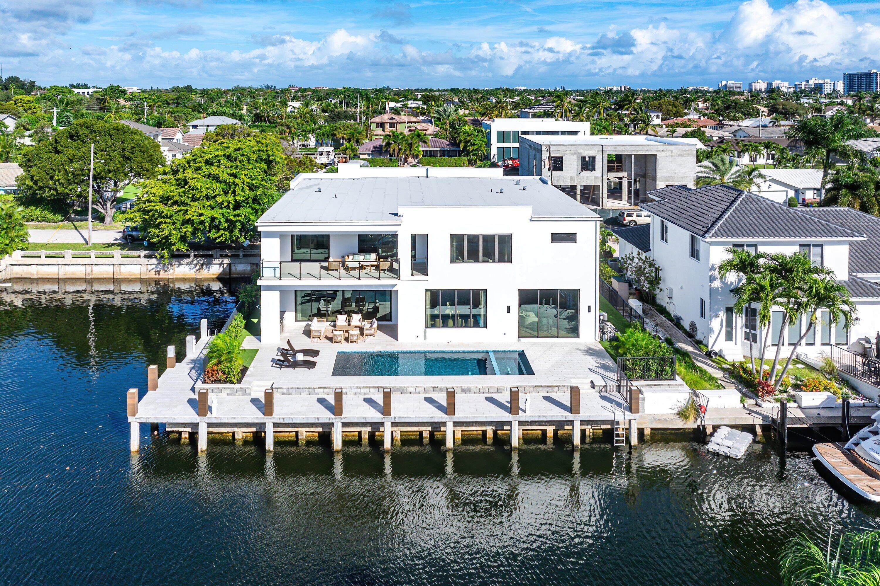 728 Enfield Street Boca Raton, FL 33487 - Photo 48 of 50 a balcony with chairs and table