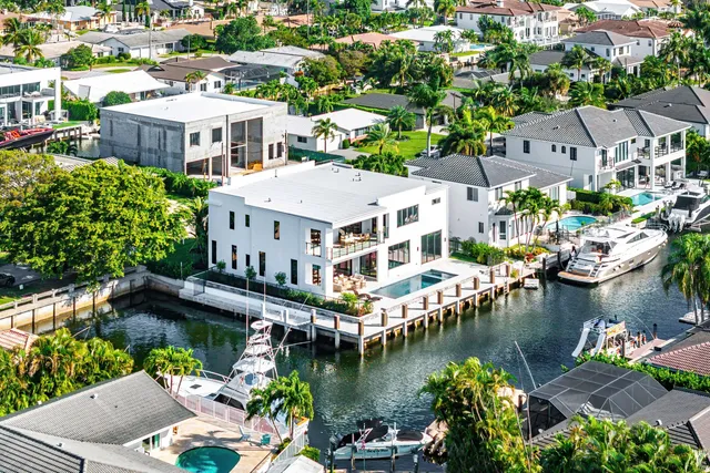 an aerial view of residential houses with outdoor space