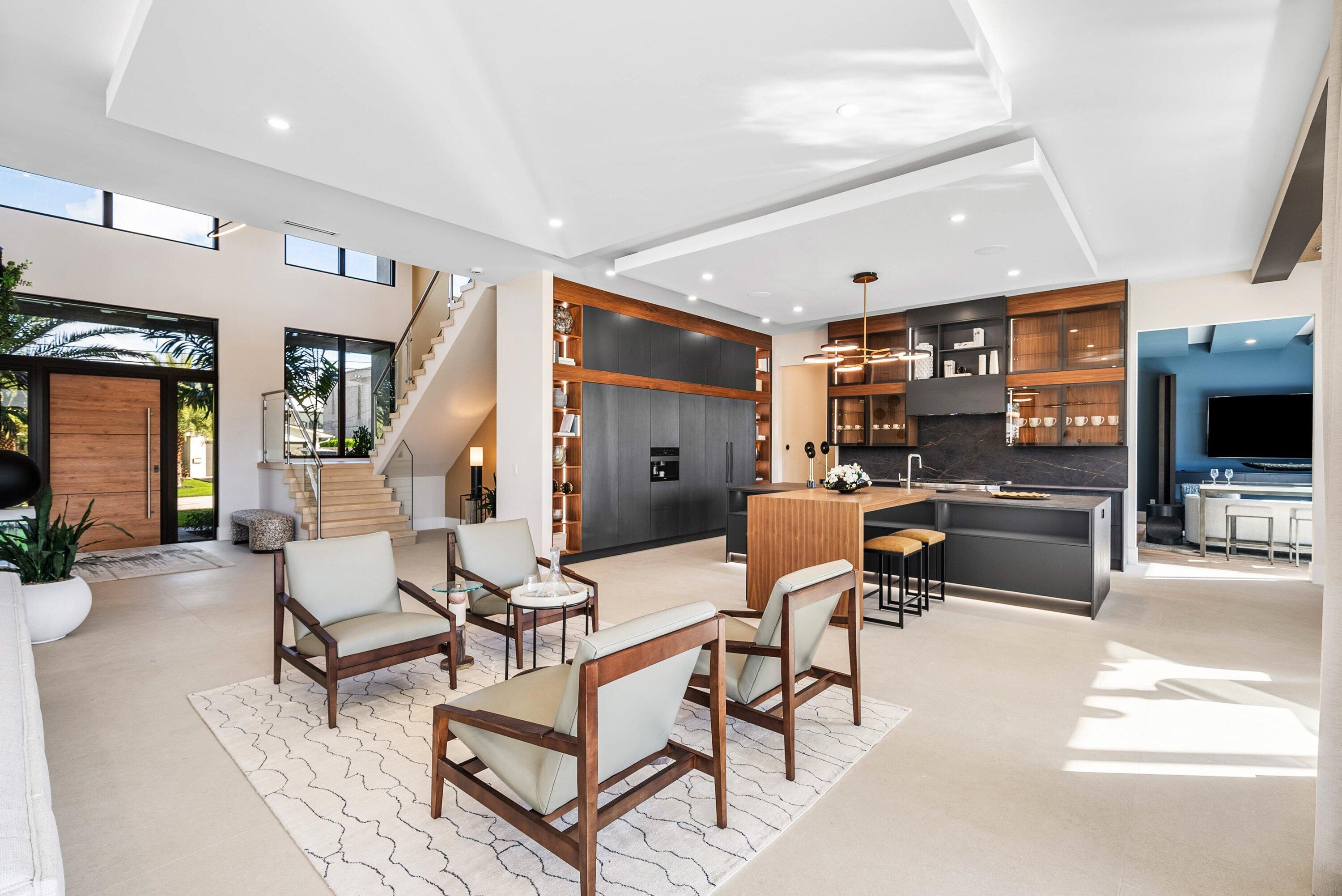 728 Enfield Street Boca Raton, FL 33487 - Photo 7 of 50 a living room with patio furniture and a flat screen tv