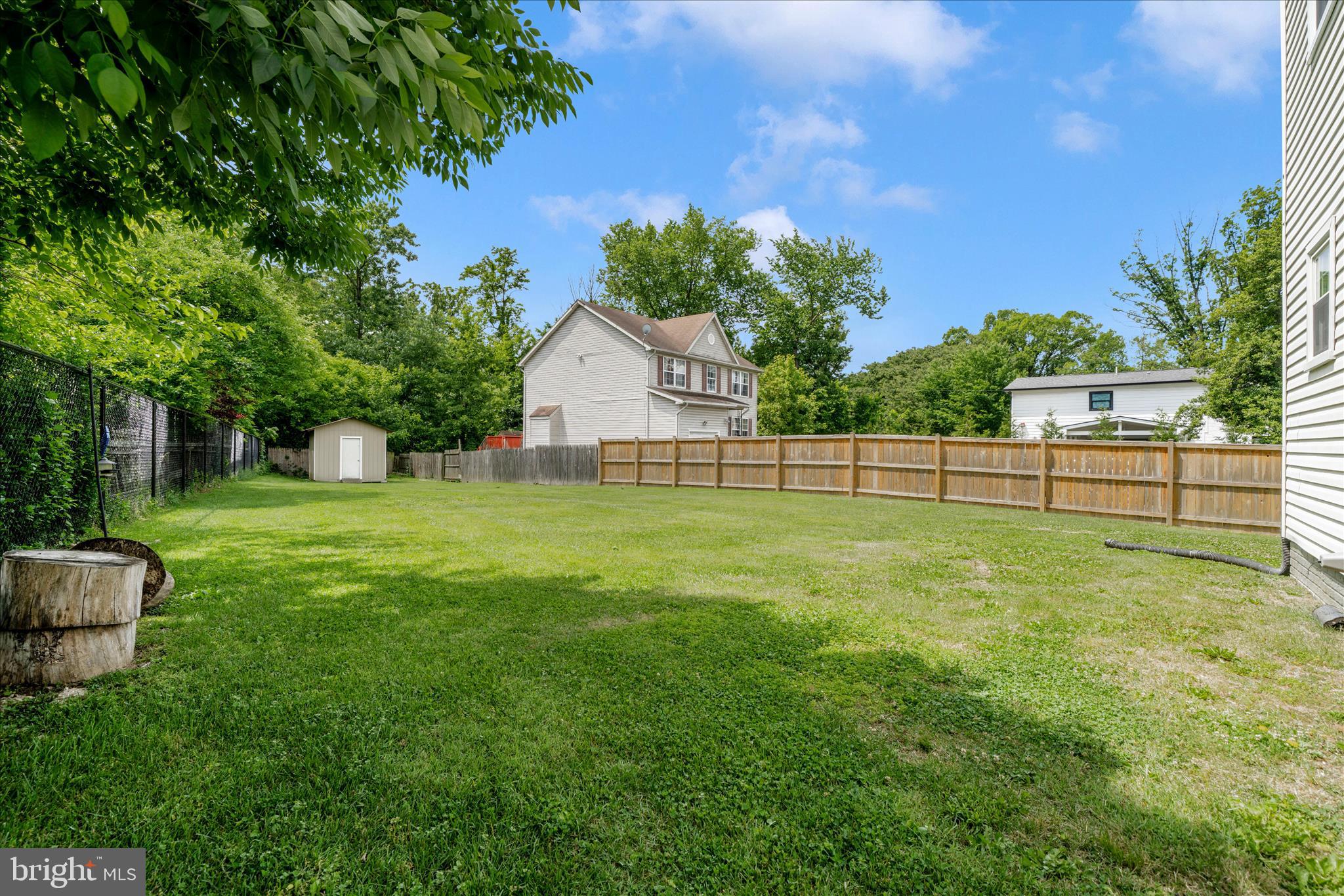 713 Seek Lane Silver Spring, MD 20912 - Photo 45 of 60 a view of a house with backyard and a garden