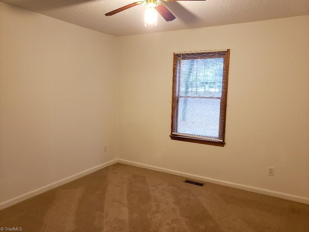 204 Beckner Road Lexington, NC 27292 - Photo 13 of 15 One of two bedrooms on front of home.