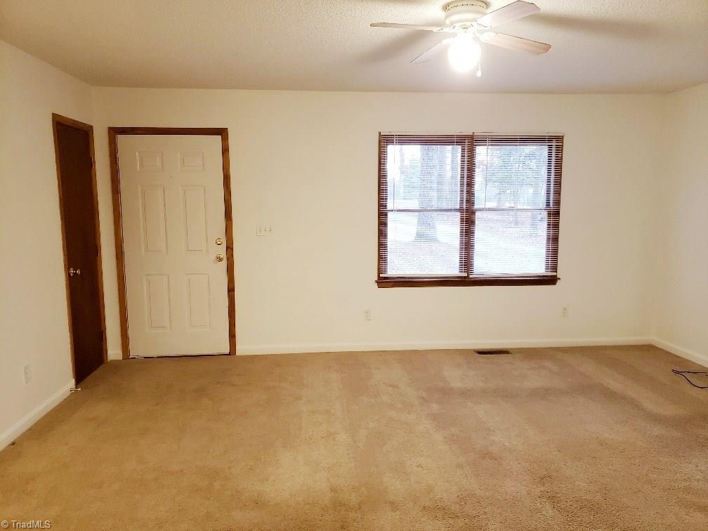 204 Beckner Road Lexington, NC 27292 - Photo 4 of 15 Living room facing front door entry. Coat closet to left.