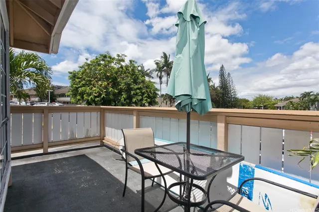 a view of a balcony with furniture