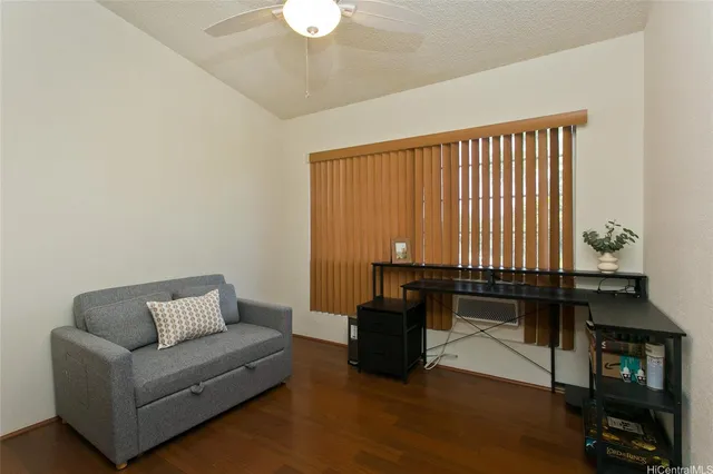 a living room with furniture a couch and a dining table