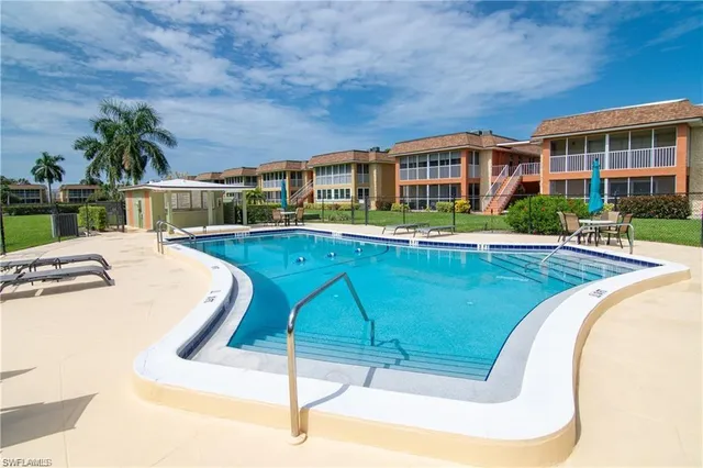 a view of a swimming pool with a patio