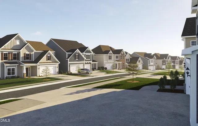 a front view of residential houses with yard