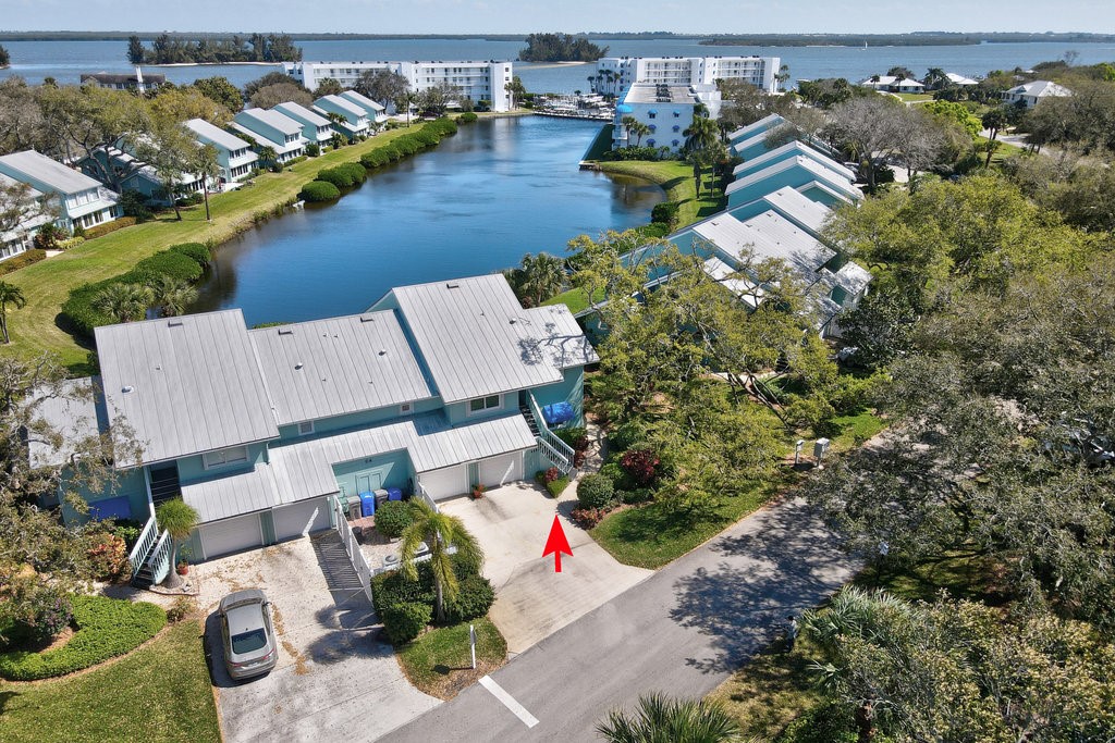 6502 River Run Drive, Unit 6502 Sebastian, FL 32958 - Photo 1 of 36 an aerial view of a house with a yard and lake view