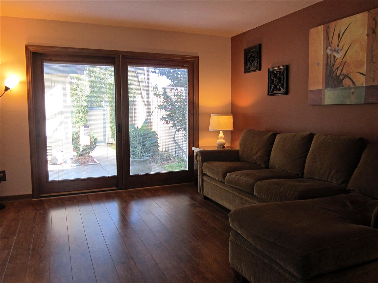 17547 Matinal Road San Diego, CA 92127 - Photo 7 of 23 Family room features wood flooring. Notice the wood cased sliders and windows on the ground floor have the blinds built in between the dual paned glass panels. No more cleaning mini blinds!!!!