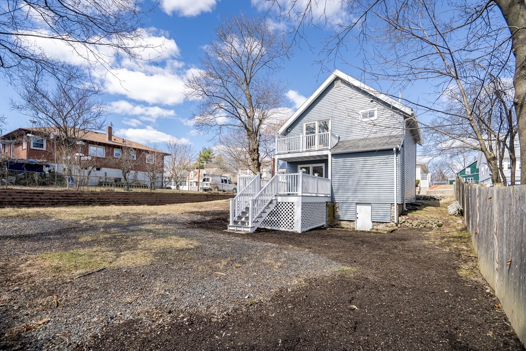 56 Riverview Street Dedham, MA 02026 - Photo 27 of 29 a view of a house with a yard