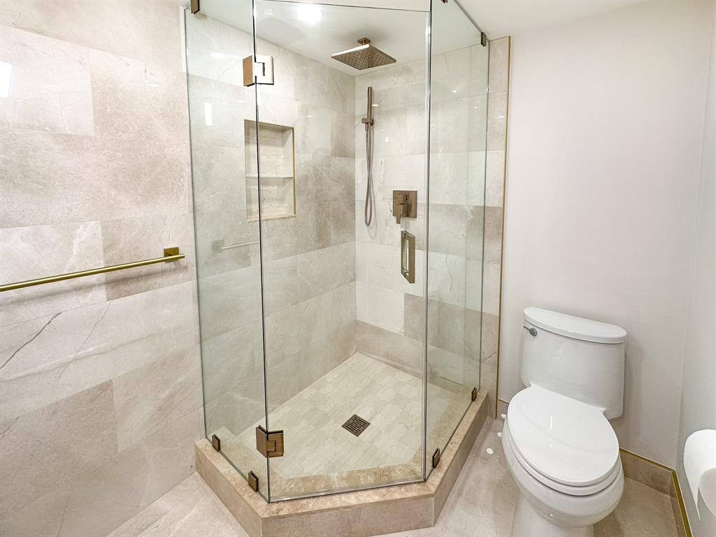 4800 Bayview Drive, Unit 503 Fort Lauderdale, FL 33308 - Photo 13 of 30 a bathroom with a shower and toilet