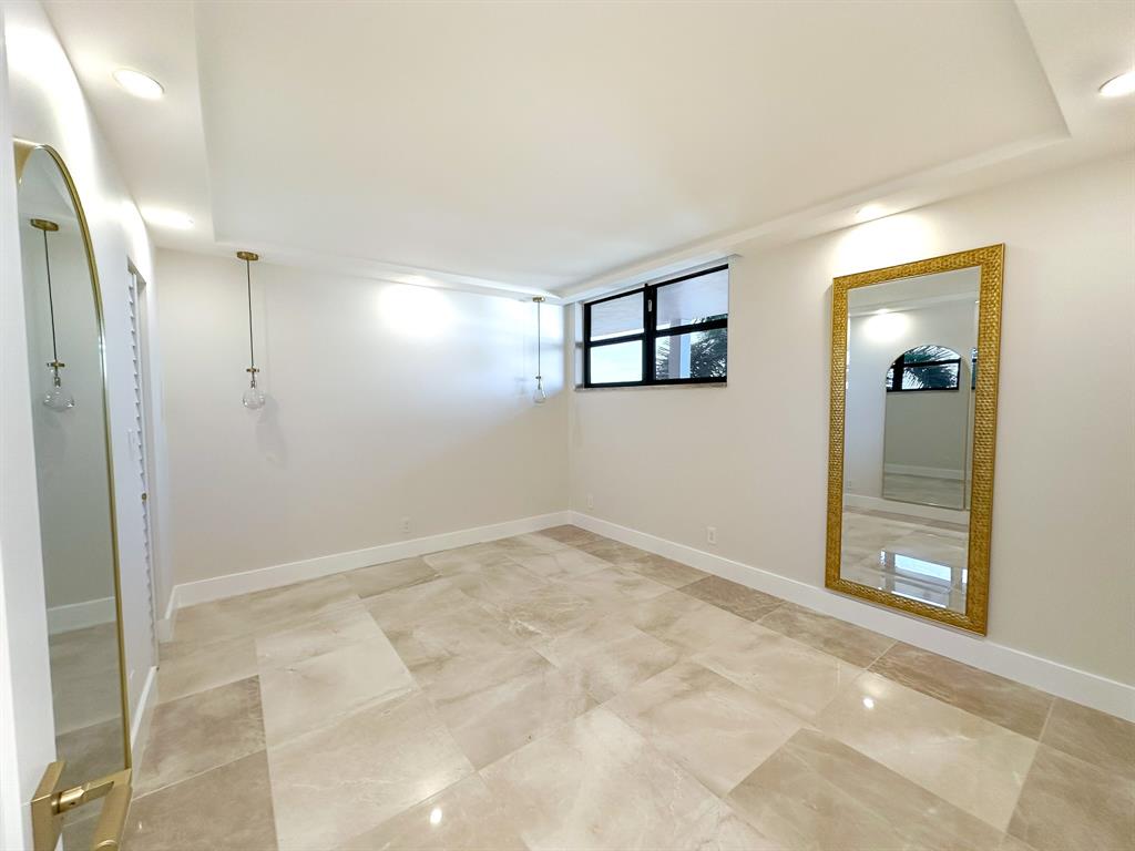 4800 Bayview Drive, Unit 503 Fort Lauderdale, FL 33308 - Photo 17 of 30 an empty room with closet and windows