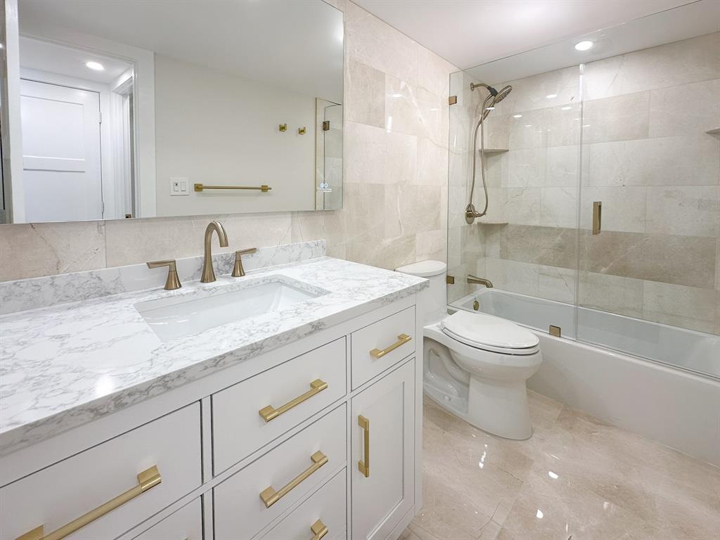 4800 Bayview Drive, Unit 503 Fort Lauderdale, FL 33308 - Photo 20 of 30 a bathroom with a granite countertop sink a toilet and shower