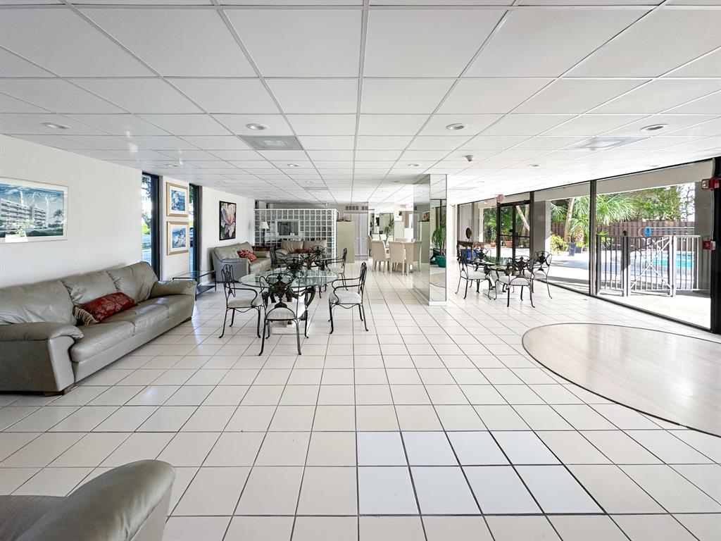 4800 Bayview Drive, Unit 503 Fort Lauderdale, FL 33308 - Photo 25 of 30 a living room with lots of furniture and white walls