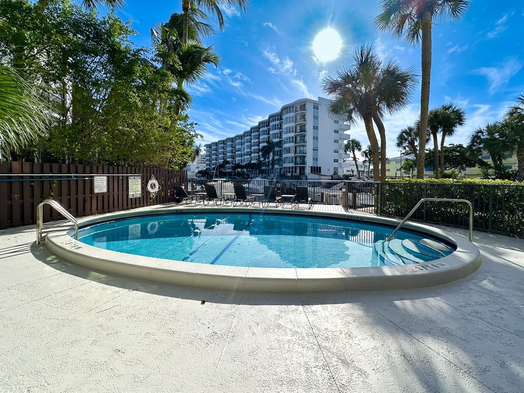 4800 Bayview Drive, Unit 503 Fort Lauderdale, FL 33308 - Photo 29 of 30 a view of a swimming pool with a house