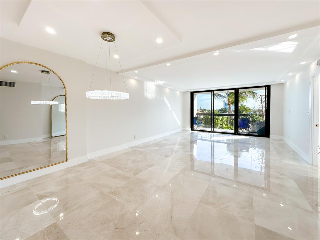 4800 Bayview Drive, Unit 503 Fort Lauderdale, FL 33308 - Photo 6 of 30 wooden floor in an empty room with a window