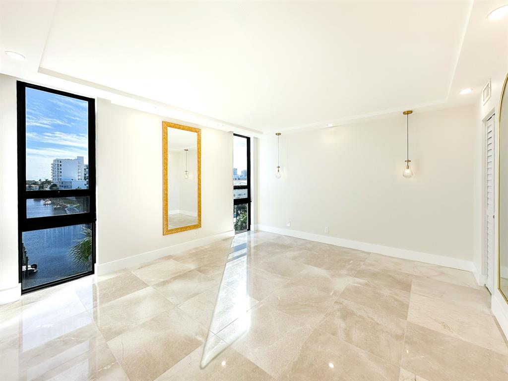 4800 Bayview Drive, Unit 503 Fort Lauderdale, FL 33308 - Photo 9 of 30 a view of an empty room with kitchen and a window