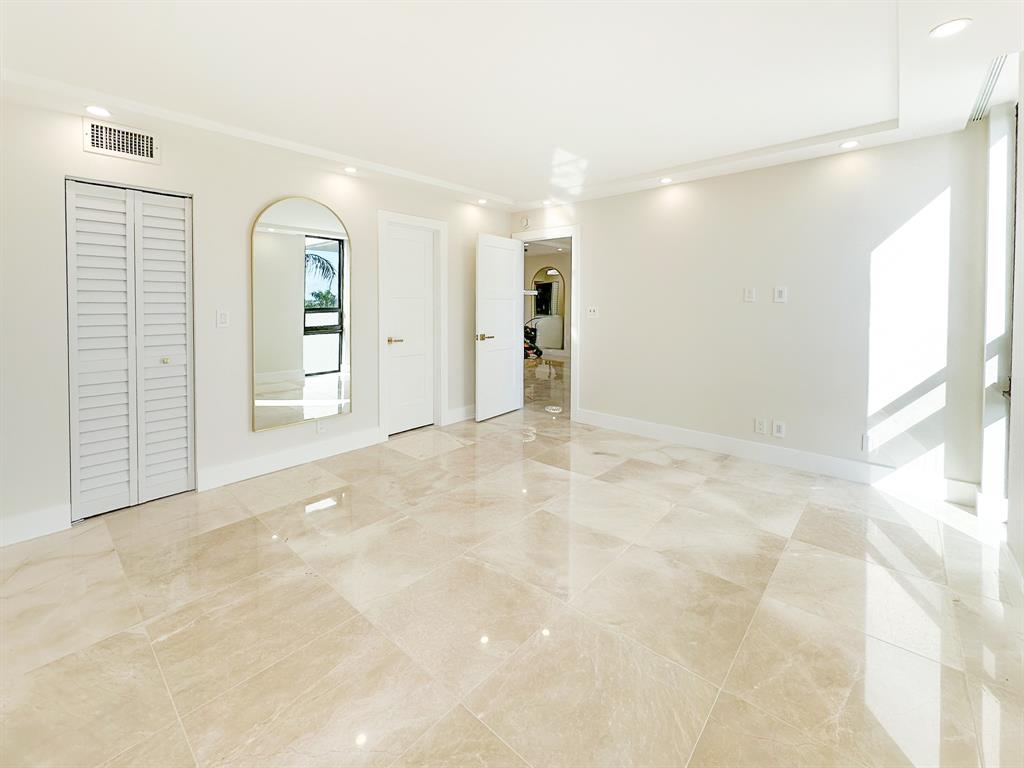 4800 Bayview Drive, Unit 503 Fort Lauderdale, FL 33308 - Photo 10 of 30 a view of an empty room with window and cabinet area