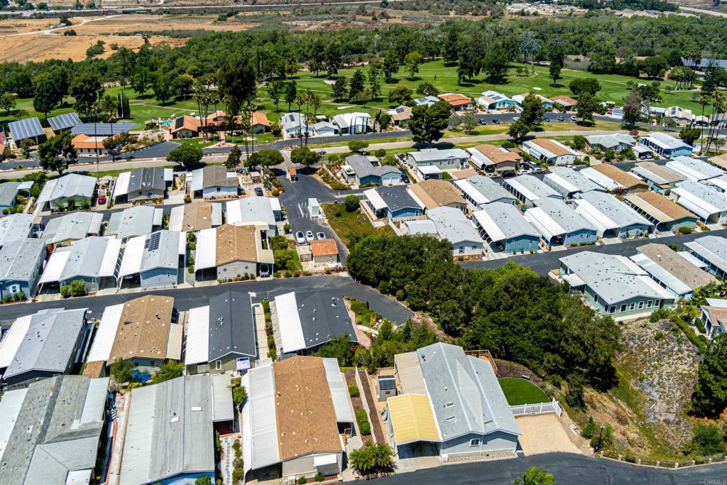 4650 Dulin Road, Unit 119 Fallbrook, CA 92003 - Photo 12 of 49 an aerial view of residential houses with outdoor space