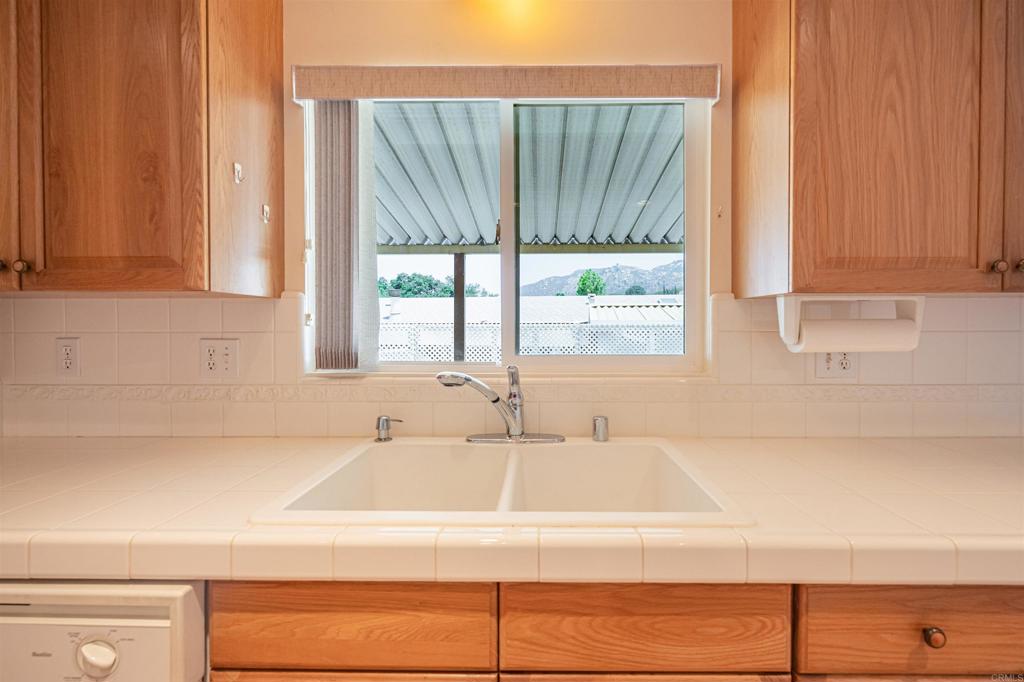 4650 Dulin Road, Unit 119 Fallbrook, CA 92003 - Photo 17 of 49 a bathroom with a bathtub and next to a window
