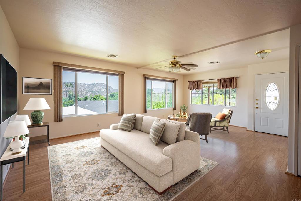 4650 Dulin Road, Unit 119 Fallbrook, CA 92003 - Photo 18 of 49 a living room with furniture and a large window