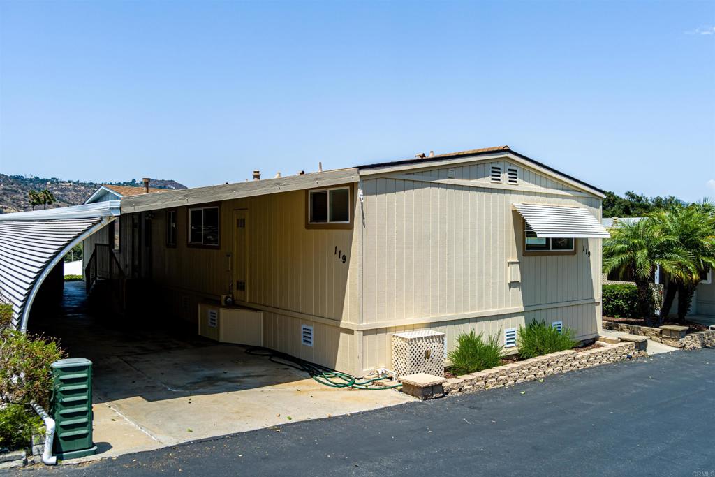 4650 Dulin Road, Unit 119 Fallbrook, CA 92003 - Photo 2 of 49 a front view of a house with a yard