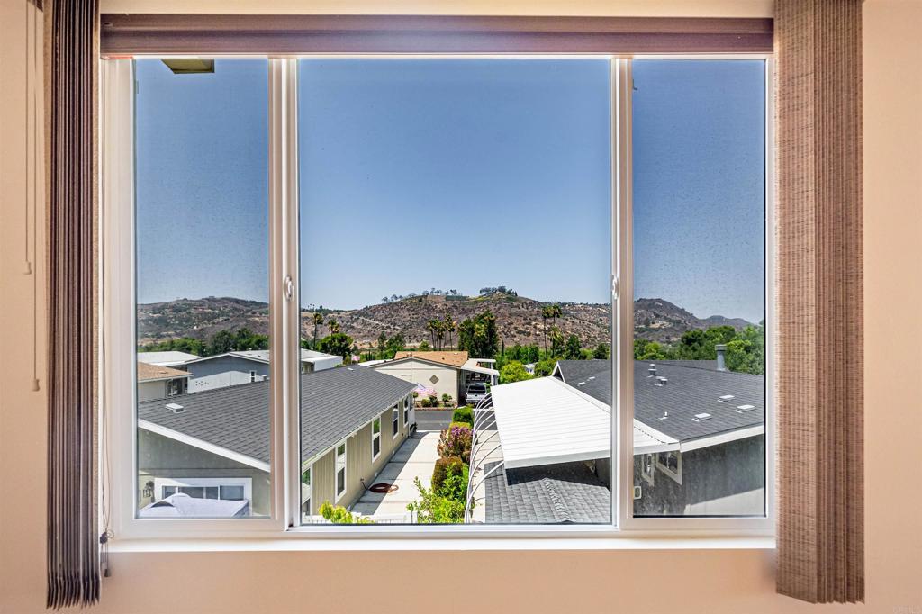 4650 Dulin Road, Unit 119 Fallbrook, CA 92003 - Photo 22 of 49 a view of a room with a large window and bed