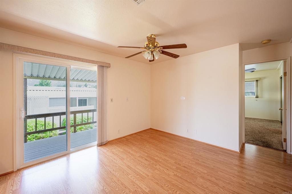 4650 Dulin Road, Unit 119 Fallbrook, CA 92003 - Photo 25 of 49 a view of empty room with wooden floor and fan
