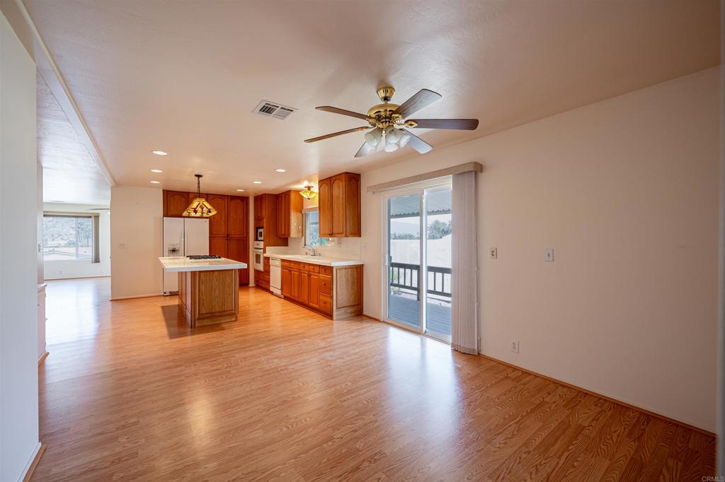4650 Dulin Road, Unit 119 Fallbrook, CA 92003 - Photo 26 of 49 a view of kitchen with furniture and wooden floor