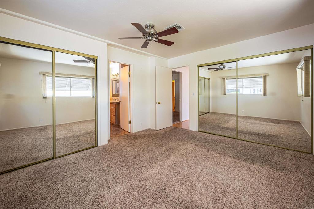4650 Dulin Road, Unit 119 Fallbrook, CA 92003 - Photo 30 of 49 an empty room with closet and windows
