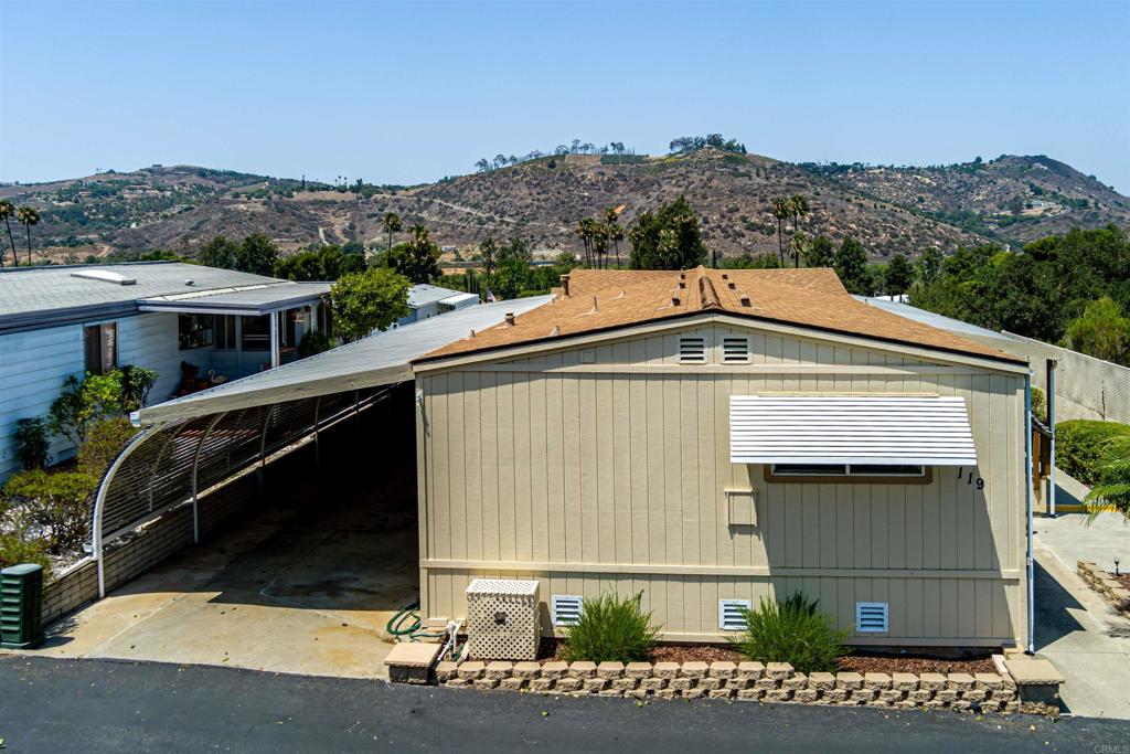 4650 Dulin Road, Unit 119 Fallbrook, CA 92003 - Photo 3 of 49 a front view of a house with a yard