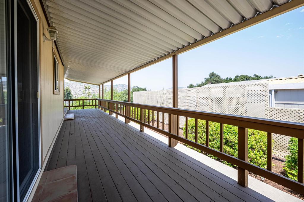 4650 Dulin Road, Unit 119 Fallbrook, CA 92003 - Photo 38 of 49 a view of a balcony with wooden floor