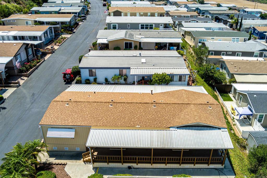 4650 Dulin Road, Unit 119 Fallbrook, CA 92003 - Photo 6 of 49 a aerial view of a house with a yard