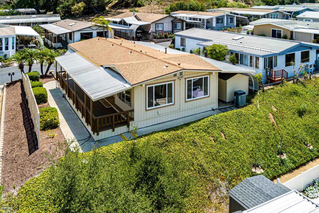 4650 Dulin Road, Unit 119 Fallbrook, CA 92003 - Photo 7 of 49 an aerial view of multiple houses with a yard