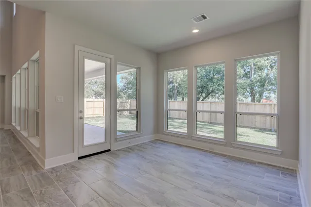 a spacious bathroom with a bathtub sink and mirror