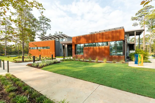 a lobby with furniture and flat screen tv