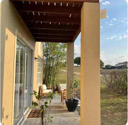 a view of balcony with furniture