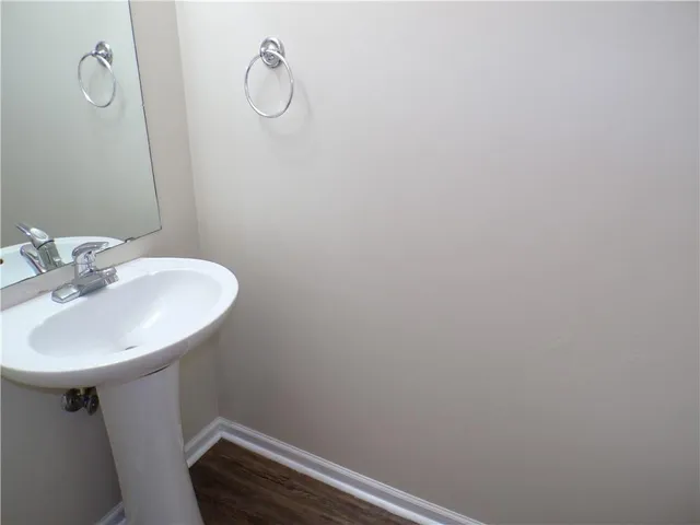 a bathroom with a sink and mirror
