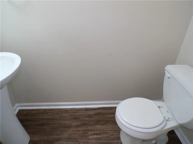 a bathroom with a toilet and a sink