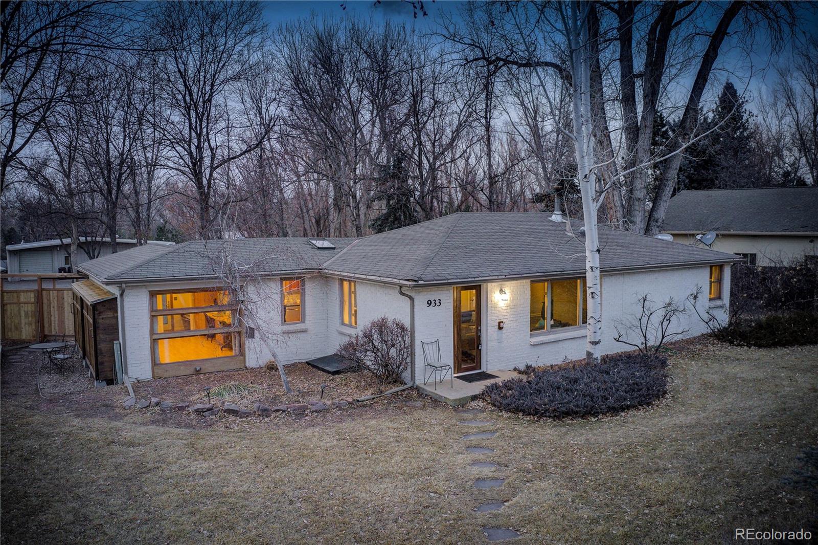 933 Cherryvale Road Boulder, CO 80303 - Photo 1 of 32 a view of a house with a yard and a tree