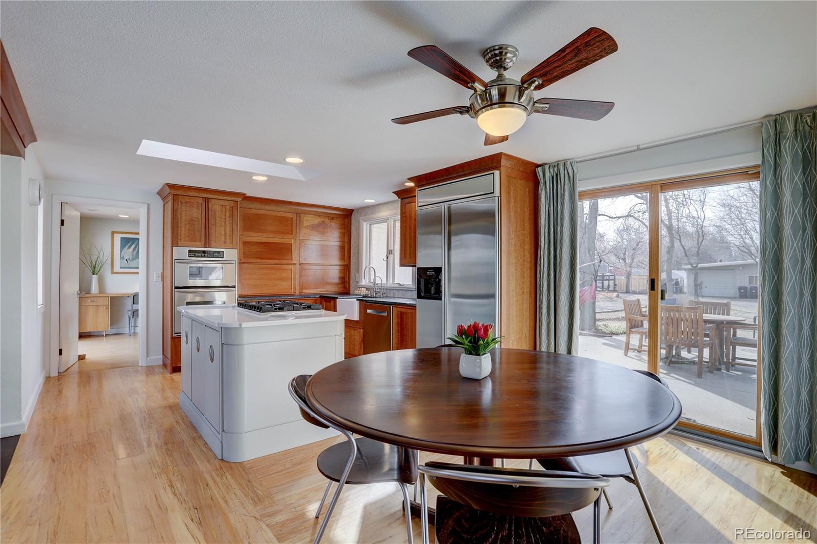 933 Cherryvale Road Boulder, CO 80303 - Photo 12 of 32 a view of a dining room with furniture window and wooden floor